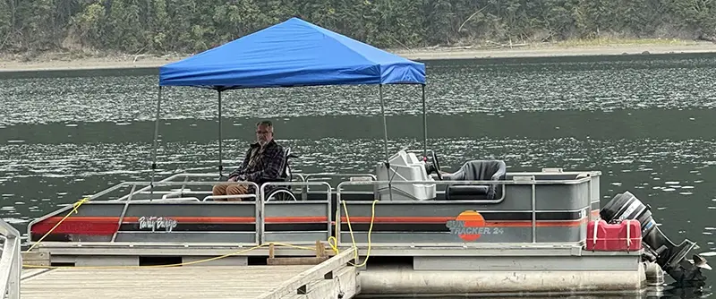 Our pontoon boat at the dock on Quesnel Lake